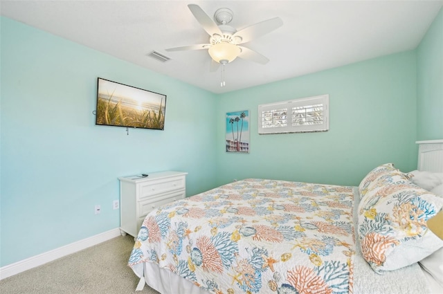 202 75th St, Holmes Beach, FL 34217 - carpeted bedroom with baseboards and a ceiling fan