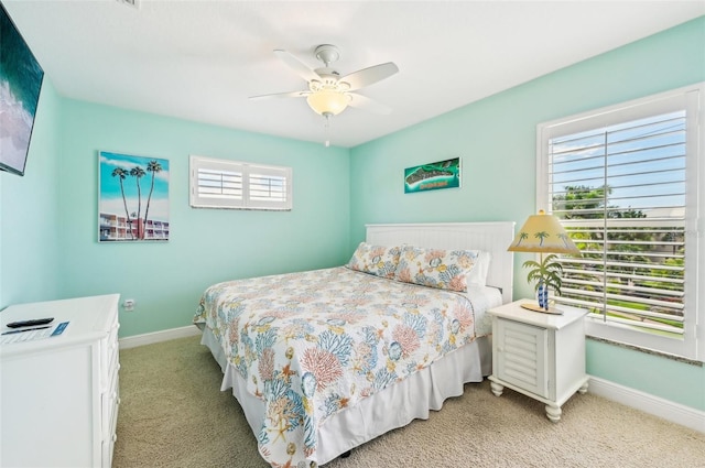 202 75th St, Holmes Beach, FL 34217 - bedroom featuring light colored carpet and ceiling fan
