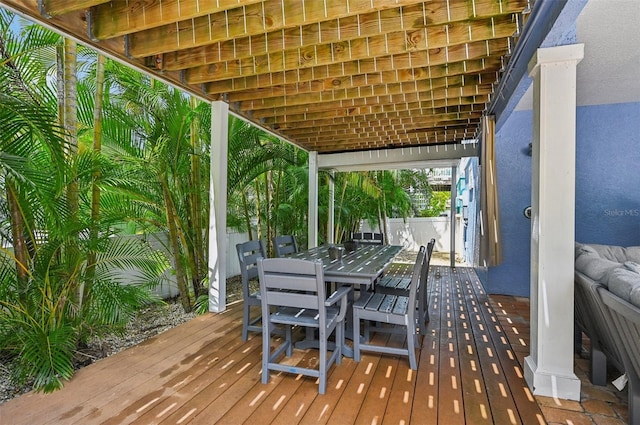 202 75th St, Holmes Beach, FL 34217 - wooden deck featuring outdoor dining area