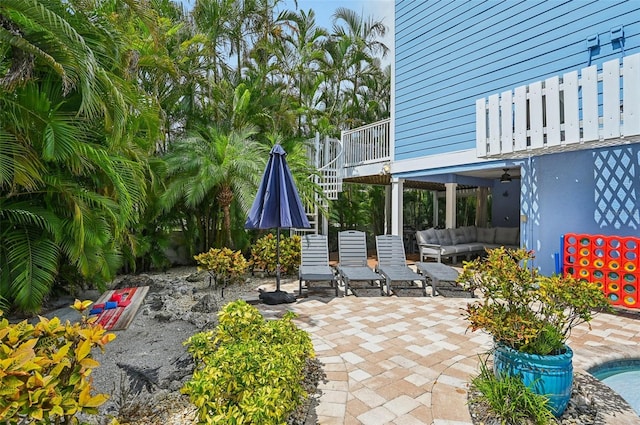 202 75th St, Holmes Beach, FL 34217 - view of patio with an outdoor living space and stairs