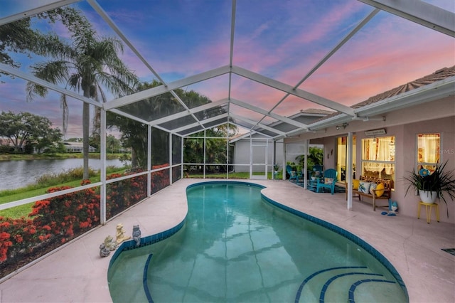 5766 Beaurivage Ave, Sarasota, FL 34243 - outdoor pool featuring a water view, a patio area, and glass enclosure