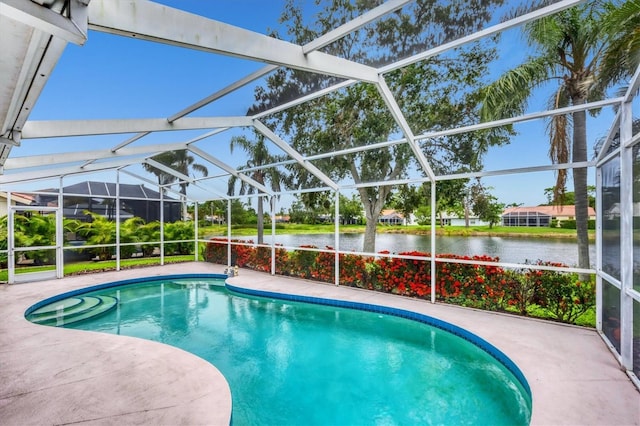 5766 Beaurivage Ave, Sarasota, FL 34243 - swimming pool featuring a water view, a patio area, and glass enclosure