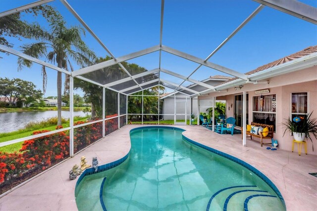5766 Beaurivage Ave, Sarasota, FL 34243 - swimming pool with a water view, a patio, and glass enclosure