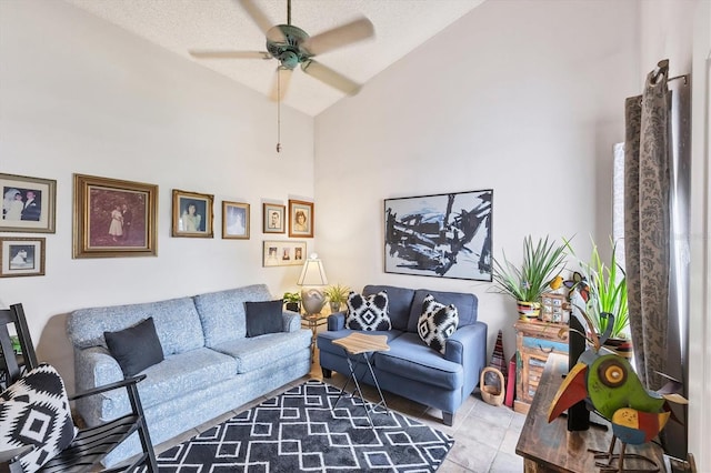 5766 Beaurivage Ave, Sarasota, FL 34243 - living room with ceiling fan, high vaulted ceiling, and tile patterned flooring