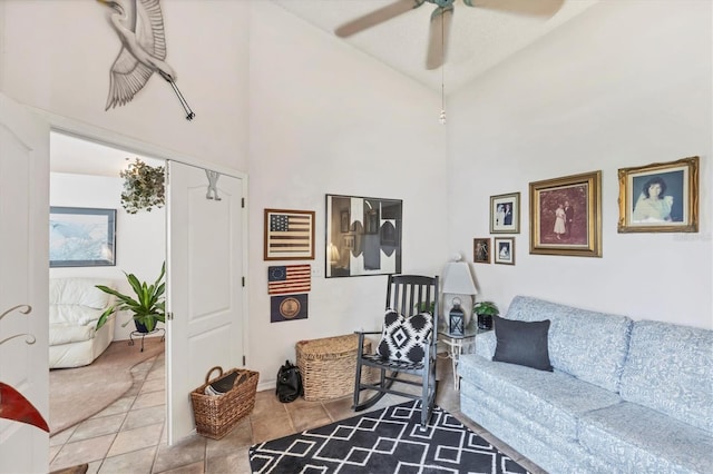 5766 Beaurivage Ave, Sarasota, FL 34243 - tiled living room with ceiling fan and high vaulted ceiling