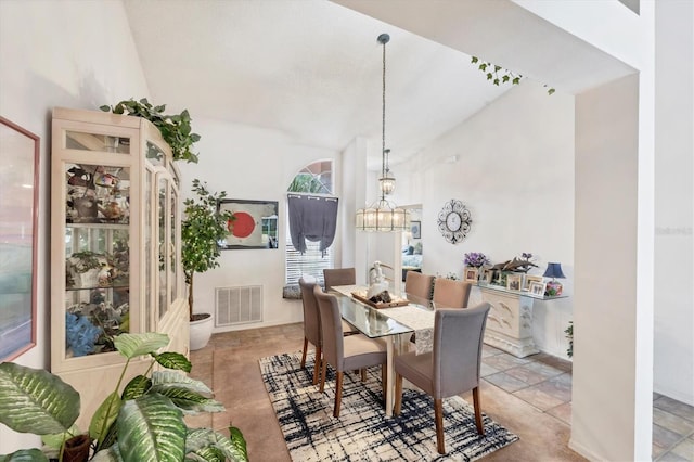 5766 Beaurivage Ave, Sarasota, FL 34243 - dining area featuring a chandelier and lofted ceiling