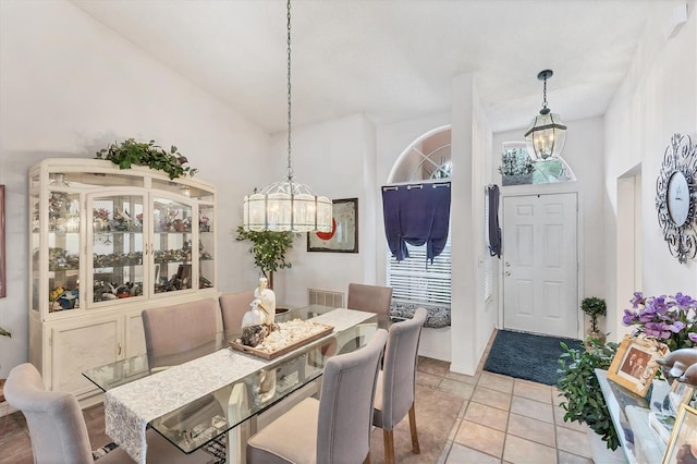 5766 Beaurivage Ave, Sarasota, FL 34243 - dining room featuring a chandelier and healthy amount of natural light