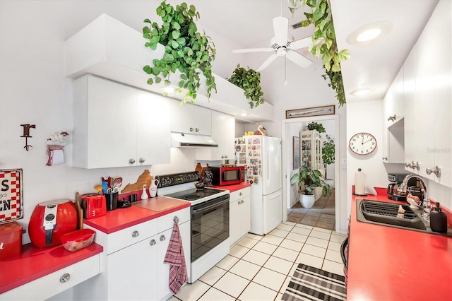 5766 Beaurivage Ave, Sarasota, FL 34243 - kitchen with white appliances, under cabinet range hood, white cabinetry, ceiling fan, and light tile patterned flooring