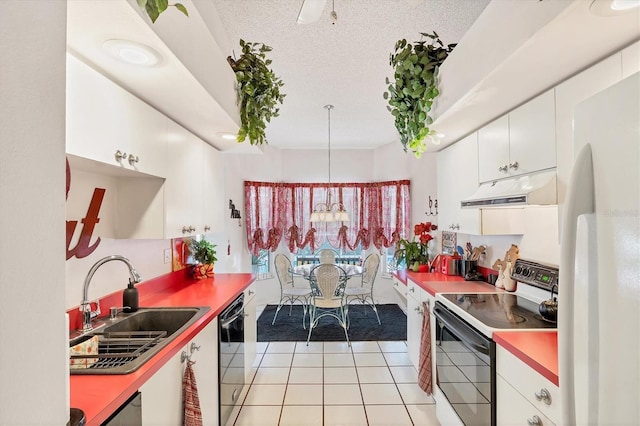 5766 Beaurivage Ave, Sarasota, FL 34243 - kitchen with electric range oven, freestanding refrigerator, under cabinet range hood, black dishwasher, and light tile patterned floors