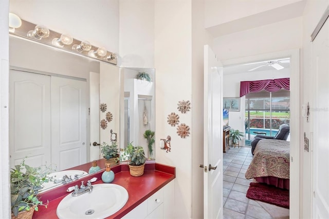 5766 Beaurivage Ave, Sarasota, FL 34243 - ensuite bathroom featuring vanity, a ceiling fan, and tile patterned flooring