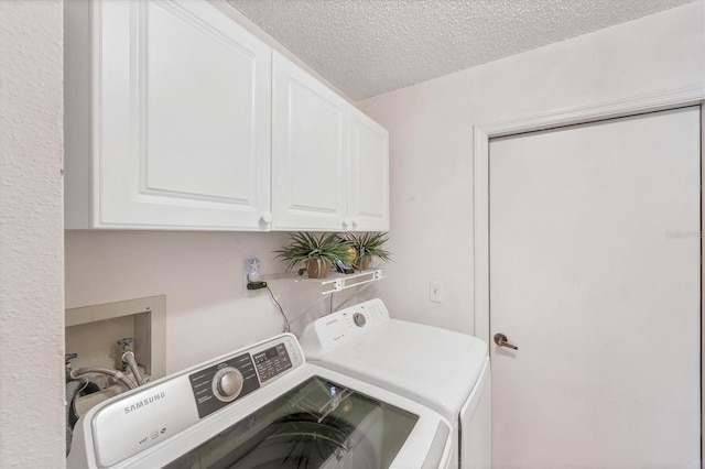 5766 Beaurivage Ave, Sarasota, FL 34243 - washroom featuring separate washer and dryer, cabinet space, and a textured ceiling