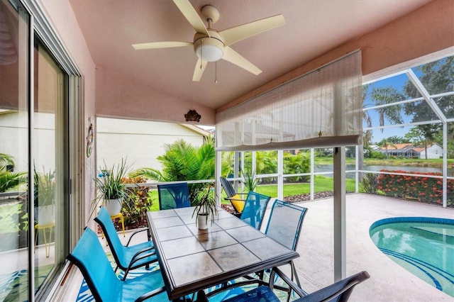5766 Beaurivage Ave, Sarasota, FL 34243 - sunroom with ceiling fan, vaulted ceiling, and outdoor dining space