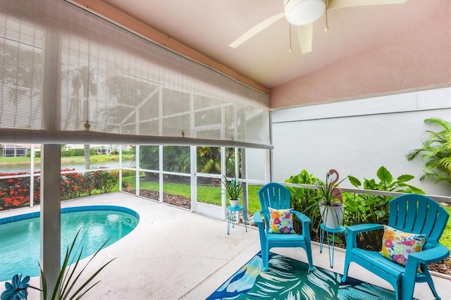 5766 Beaurivage Ave, Sarasota, FL 34243 - outdoor pool with a ceiling fan, a patio area, and glass enclosure