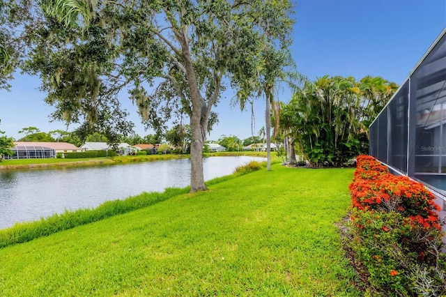 5766 Beaurivage Ave, Sarasota, FL 34243 - view of green lawn featuring a water view and a lanai