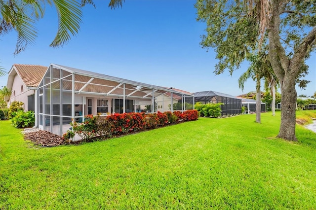 5766 Beaurivage Ave, Sarasota, FL 34243 - view of grassy yard with a lanai