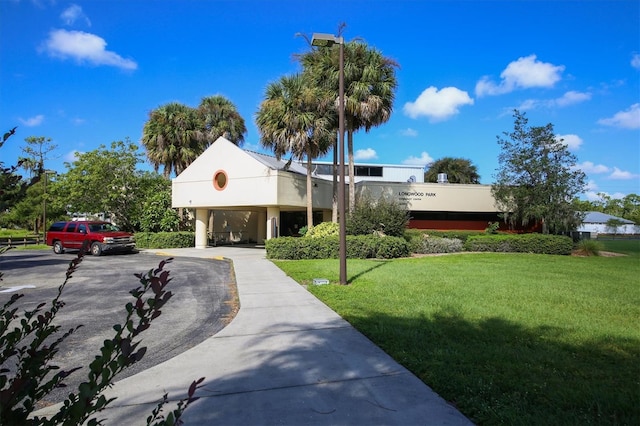 5766 Beaurivage Ave, Sarasota, FL 34243 - view of building exterior with asphalt driveway