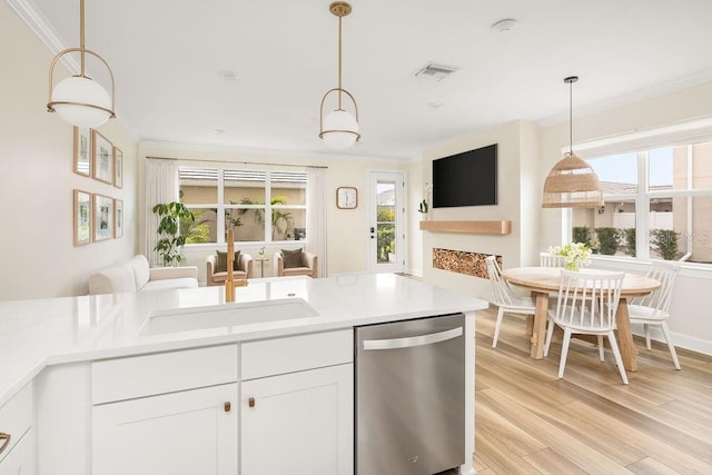 12017 Cranston Way, Bradenton, FL 34211 - kitchen with dishwasher, open floor plan, crown molding, healthy amount of natural light, and light wood-type flooring