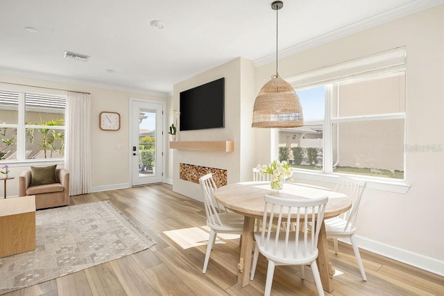 12017 Cranston Way, Bradenton, FL 34211 - dining space with crown molding and wood finished floors