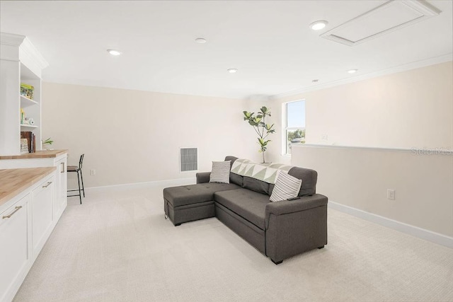 12017 Cranston Way, Bradenton, FL 34211 - living room featuring light colored carpet, recessed lighting, and crown molding