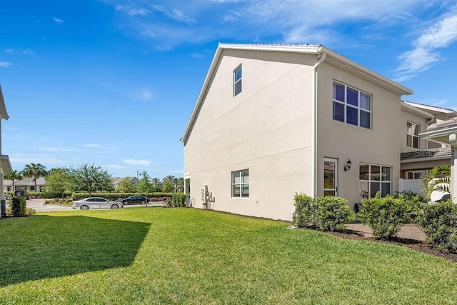 12017 Cranston Way, Bradenton, FL 34211 - view of side of home with stucco siding and a yard