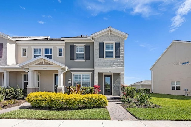 12017 Cranston Way, Bradenton, FL 34211 - view of front of house featuring stucco siding and a front yard