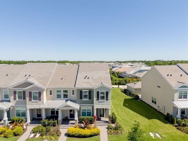 12017 Cranston Way, Bradenton, FL 34211 - view of front of house featuring stucco siding, a front yard, covered porch, and a residential view
