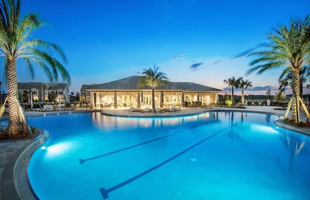 12017 Cranston Way, Bradenton, FL 34211 - pool at dusk with a community pool and a patio area
