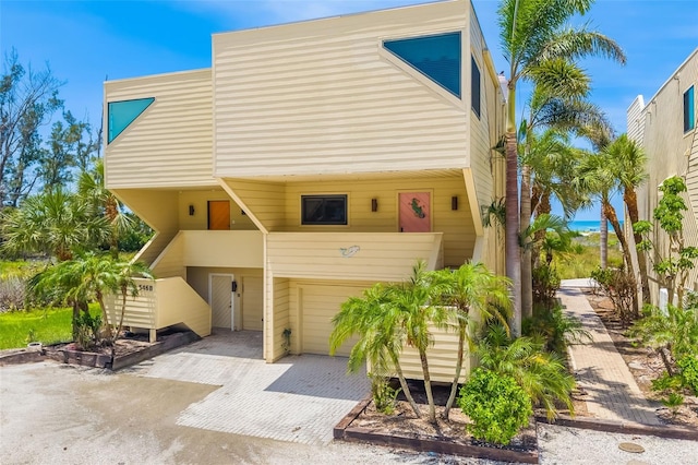546A Beach Rd Unit A544, Sarasota, FL 34242 - view of front of home featuring decorative driveway and a garage