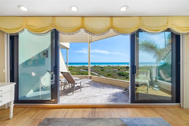 546A Beach Rd Unit A544, Sarasota, FL 34242 - doorway with a water view and wood finished floors