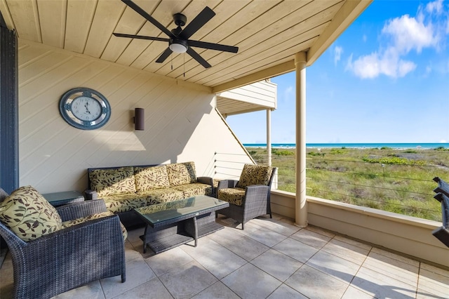 546A Beach Rd Unit A544, Sarasota, FL 34242 - sunroom / solarium with a ceiling fan, an outdoor living space, and a water view