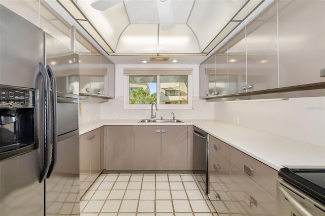 546A Beach Rd Unit A544, Sarasota, FL 34242 - kitchen with stainless steel appliances, gray cabinetry, and light countertops