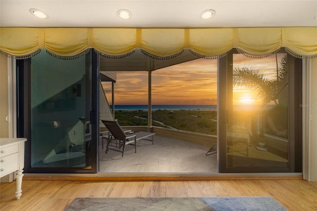 546A Beach Rd Unit A544, Sarasota, FL 34242 - doorway to outside featuring wood finished floors and a water view