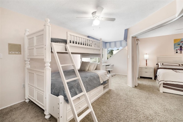 546A Beach Rd Unit A544, Sarasota, FL 34242 - carpeted bedroom featuring a textured ceiling and a ceiling fan