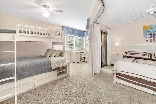 546A Beach Rd Unit A544, Sarasota, FL 34242 - bedroom featuring a textured ceiling, carpet, and ceiling fan