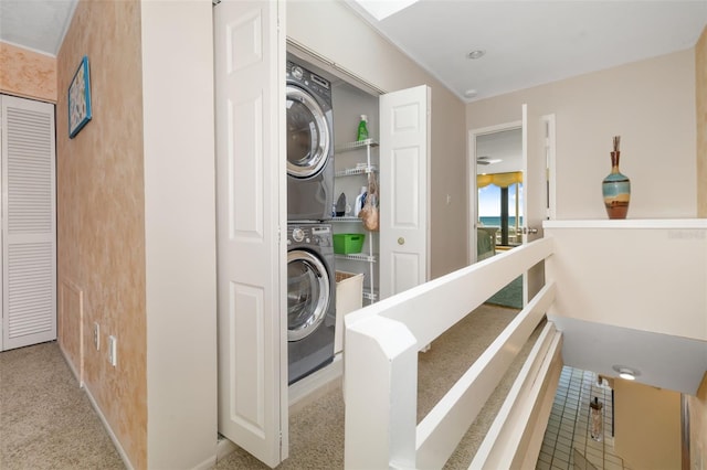 546A Beach Rd Unit A544, Sarasota, FL 34242 - washroom with stacked washer / dryer and baseboards