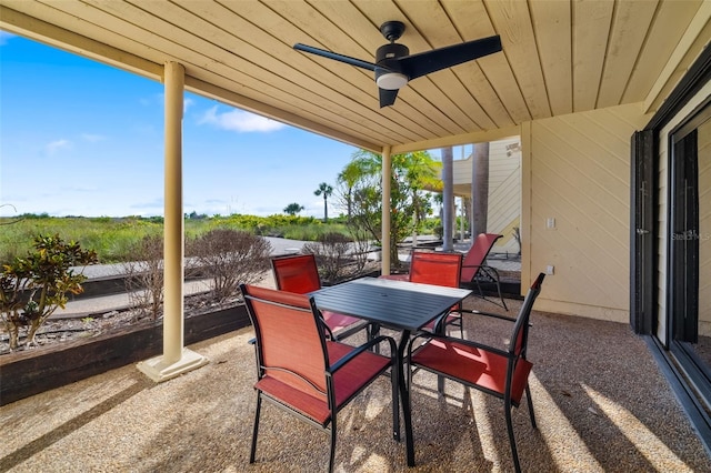 546A Beach Rd Unit A544, Sarasota, FL 34242 - view of patio / terrace with outdoor dining space, a ceiling fan, and a water view