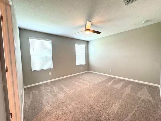5812 Ocean Isle Dr, Nokomis, FL 34275 - spare room featuring carpet, ceiling fan, and a textured ceiling