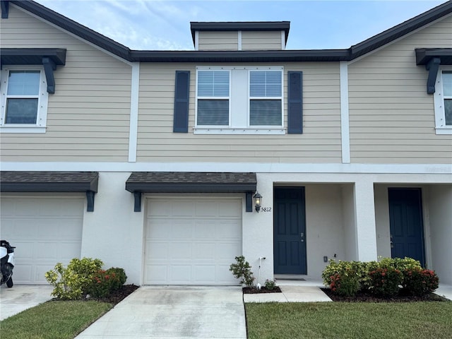 5812 Ocean Isle Dr, Nokomis, FL 34275 - view of property featuring a garage and stucco siding
