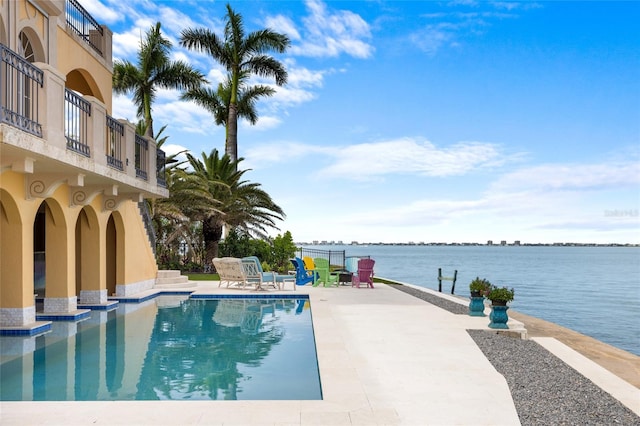 309 Ringling Point Dr, Sarasota, FL 34234 - outdoor pool with a patio area and a water view