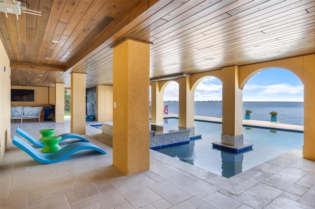 309 Ringling Point Dr, Sarasota, FL 34234 - indoor pool featuring a patio and a water view