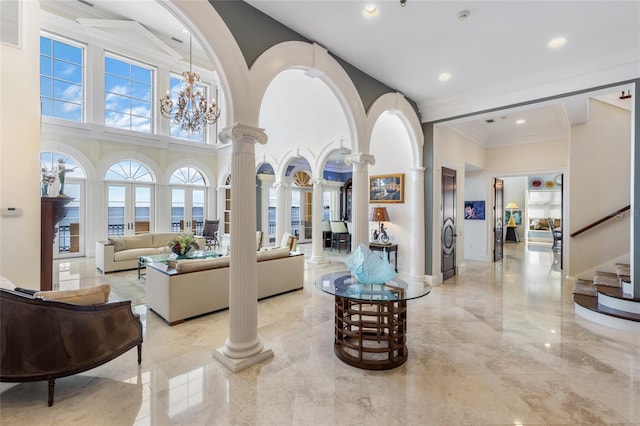 309 Ringling Point Dr, Sarasota, FL 34234 - building lobby with a high ceiling, ornamental molding, stairs, and recessed lighting