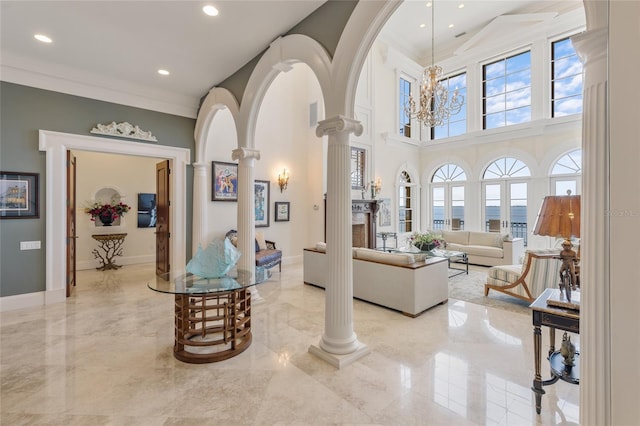 309 Ringling Point Dr, Sarasota, FL 34234 - interior space with ornate columns, light marble finish floors, crown molding, recessed lighting, and a high ceiling