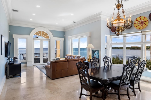 309 Ringling Point Dr, Sarasota, FL 34234 - dining space with a chandelier, recessed lighting, ornamental molding, a water view, and french doors