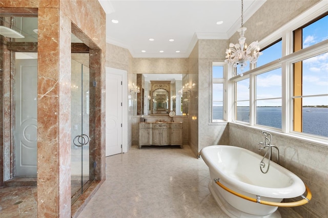 309 Ringling Point Dr, Sarasota, FL 34234 - full bathroom with healthy amount of natural light, crown molding, a chandelier, a freestanding tub, and vanity