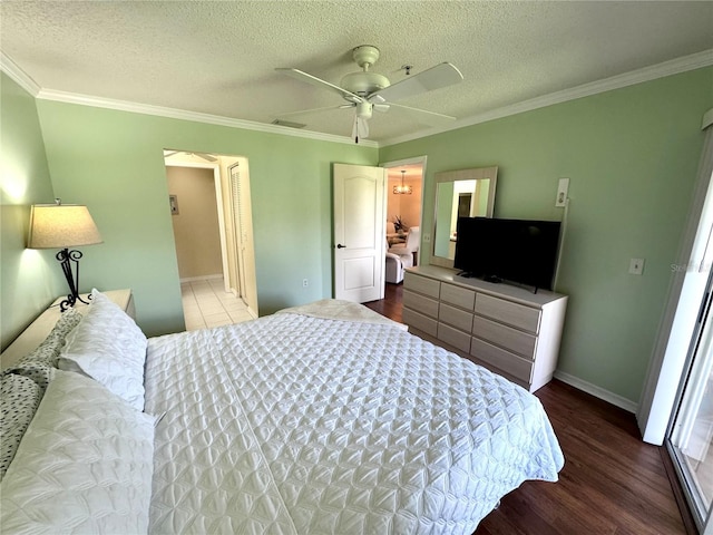 6505 Stone River Rd Unit 309, Bradenton, FL 34203 - bedroom featuring wood finished floors, crown molding, a textured ceiling, and ceiling fan