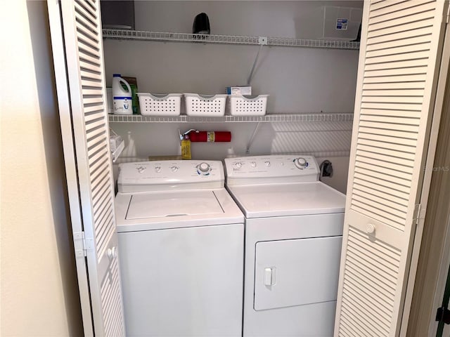 6505 Stone River Rd Unit 309, Bradenton, FL 34203 - laundry area with washing machine and clothes dryer
