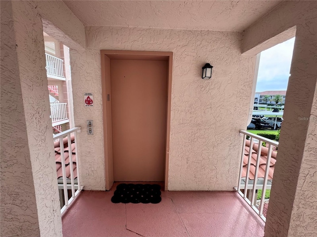 6505 Stone River Rd Unit 309, Bradenton, FL 34203 - property entrance with a balcony and elevator