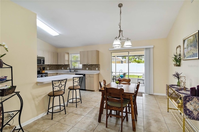 4649 72nd Ct E, Bradenton, FL 34203 - dining space featuring lofted ceiling and light tile patterned floors