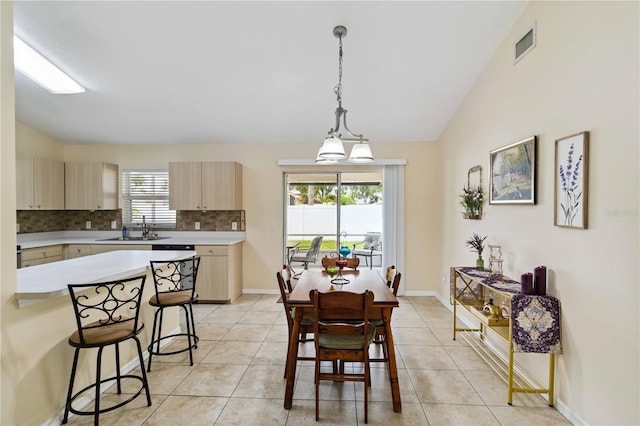 4649 72nd Ct E, Bradenton, FL 34203 - dining area with light tile patterned floors and vaulted ceiling