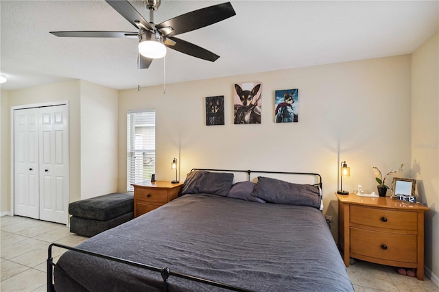 4649 72nd Ct E, Bradenton, FL 34203 - bedroom featuring light tile patterned flooring, a ceiling fan, and a closet